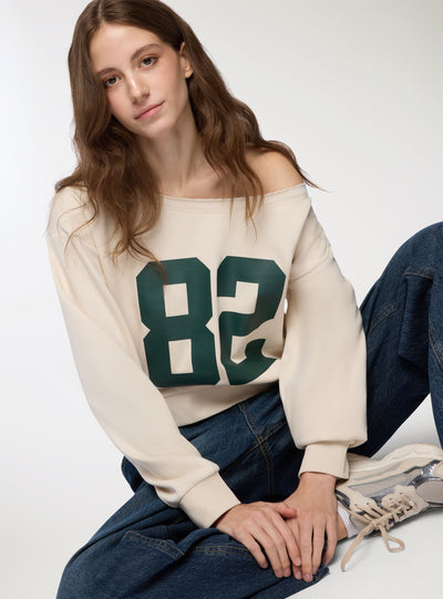 Felpa crop con spalle scoperte e numero