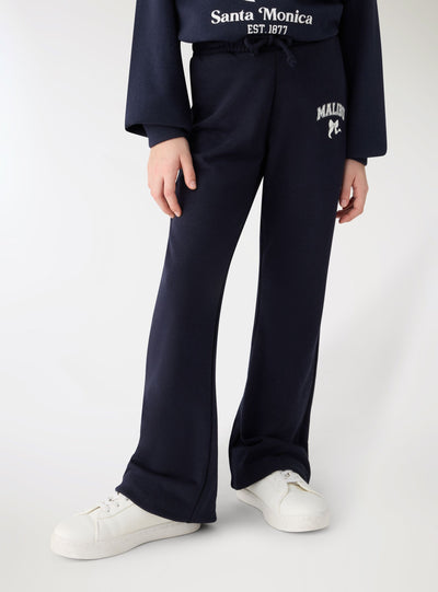 Pantaloni tuta a zampa con stampa college