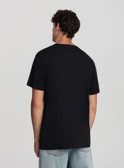 T-shirt relaxed con scritta e bande