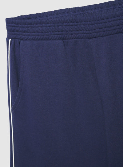 Pantaloni tuta wide leg con bande laterali