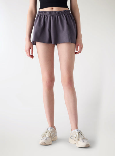 Pantaloncini tuta corti svasati a tinta unita