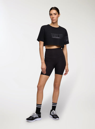 T-shirt sportiva crop over con scritta
