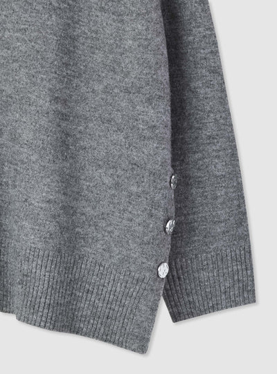 Maglia con bottoni decorativi