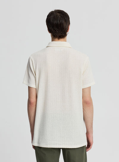 T-shirt polo a tinta unita effetto crochet