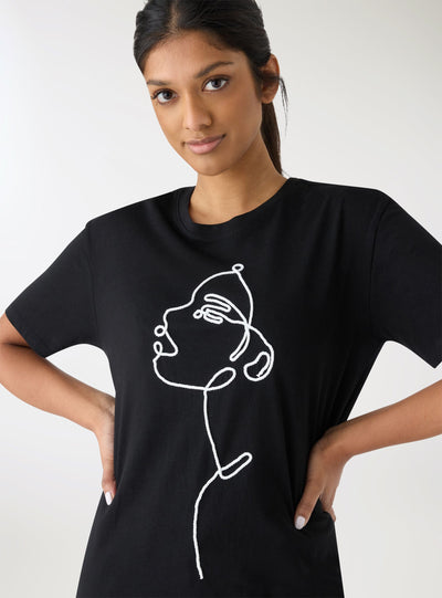 T-shirt con ricamo volto