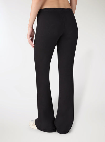 Pantaloni tuta lunghi a zampa vita bassa