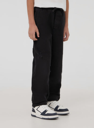 Jogger con strappi e coulisse