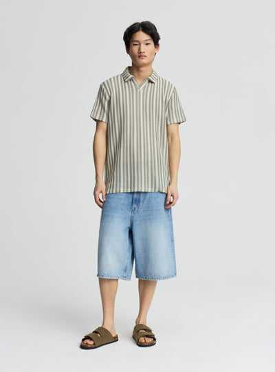 T-shirt polo a righe effetto crochet