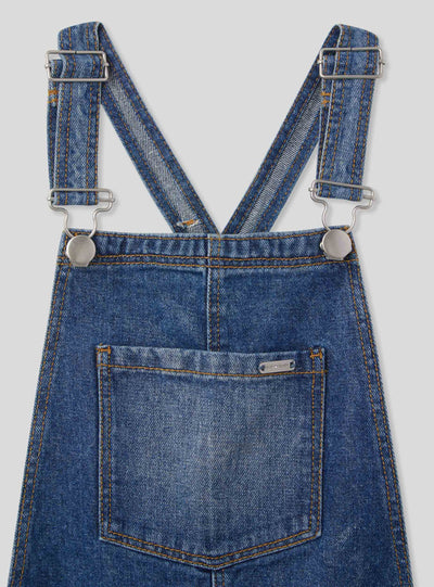 Salopette in jeans medio con strappi