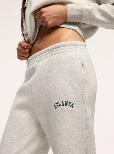 High-waisted sweatpants with college lettering
