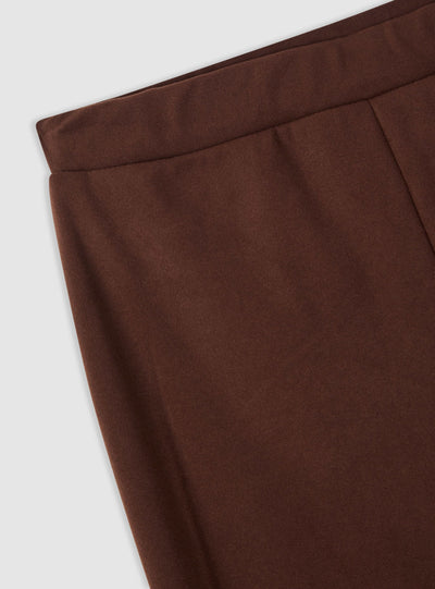 Pantaloni tuta a zampa tinta unita