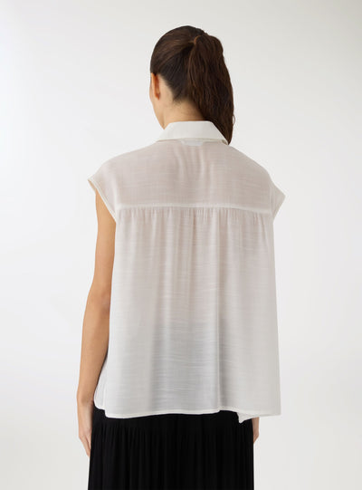 Camicia smanicata con nodo e taschini