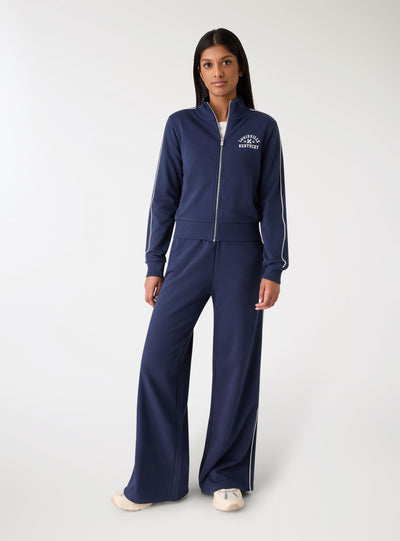Pantaloni tuta wide leg con bande laterali